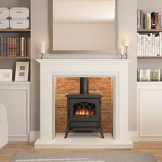 a fire place in a living room next to a book shelf