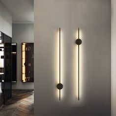 two modern wall lights in an empty room