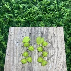 "Pretty, lightweight floral earrings! These have a magical, fae-like feel, perfect for nature lovers! These earrings feature lime green flowers with semi-translucent lime green beads and lime green leaves. *Length (using default ear hooks): 2.75\" *Weight (approx, each): 2.5g ✨Upgradable earring options available are: Gauge sizes are approximate. Some options may be in limited supply and may take additional time to ship. *304 Steel mini hooks, silver color, 22 gauge (0.7mm). This is the perfect Green Dangle Earrings For Spring, Spring Green Dangle Earrings, Spring Green Flower Earrings With Ear Wire, Green Earrings For Spring, Spring Green Flower Earrings, Green Spring Jewelry With Ear Wire, Green Dangle Jewelry For Spring, Green Jewelry With Ear Wire For Spring, Green Flower-shaped Nature-inspired Earrings