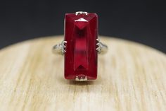 This is a super unique ring. Excellent Pinkie ring. LC ruby glass stone Condition: Shows minimal signs of wear. Has not been polished. Details: 14k White Gold 4.4grams Marked 14k 8mm by 18mm Rectangle LC Ruby glass 6mm rise sz 5.25 Antique Ruby Ring, Pinkie Ring, Art Deco Filigree, Ring Art Deco, Ring Antique, Gorgeous Jewelry, Ruby Ring, Rings Statement, Unique Rings