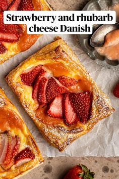 strawberry and rhubarb cheese danish with strawberries on the table next to it