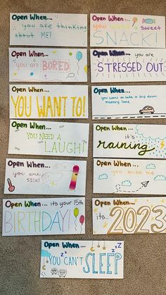 several handmade birthday cards laid out on the floor for someone to write their name