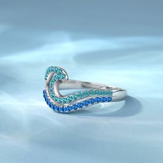 The design of this promise ring is made of two layers of wave design, the upper layer is light blue, the lower layer is dark blue, very vivid expression of the wave in your finger with gradient color. Wear this pave wave ring to the beach in the summer, will definitely have a more fashionable sense. This Promise ring is also suitable daily or official occasion, simple and cool.Material: 925 SilverPlating Color: Silver Wave Ring, Pave Ring, Wave Design, Blue Waves, The Wave, Gradient Color, Promise Ring, Cocktail Rings, Promise Rings