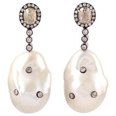 These pearl earrings are thoughtfully and meticulously crafted with 18 Karat yellow gold. It is set with 68.5 carats pearl and 1.74 carats diamonds. FOLLOW MEGHNA JEWELS storefront to view the latest collection & exclusive pieces. Meghna Jewels is proudly rated as a Top Seller on 1stDibs with 5 star customer reviews. All items manufactured by us are handmade and can be customized or redesigned. Composition Size-45X16 MM Total Weight-19.581 Gold Weight(Gms)-5.532 Diamond Wt(Cts)-1.74 Pearl Wt(Cts Drop Beads, Beaded Dangle Earrings, Mens Jewelry Bracelet, Beaded Dangles, Heart Jewelry, Birthstone Jewelry, Pave Diamonds, Jewelry Sales, Jewelry Earrings Dangle