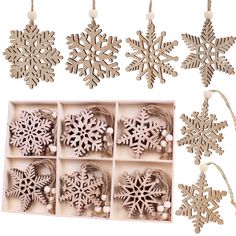 wooden snowflake ornaments in an open box with string and decorations hanging from it