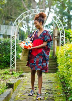 The stunning Carnation dress embraces the essence of African Ankara prints with its intricate patchwork pattern that celebrates the beauty of diversity and unity. Each patch tells a story, woven together in perfect harmony.The vibrant red fabric adorning the front of the dress instantly catches the eye, radiating warmth and energy. Designed to flatter all body types, this free dress provides a relaxed yet chic silhouette that gracefully drapes around your figure.  -This mini-Kaftan dress has pockets on both sides and features a low Vneck design.  -The model is wearing a UK 6/XS.  -She is 5'6/168 cm tall. SIZE GUIDE XXS/ UK 4 / US 0 =  B -32  W -24  H -34   XS / UK 6 / US 2 =  B -34  W -26  H - 36 S / UK 8 / US 4 =  B - 35  W - 28 H -38   M / UK 10 / US 6 = B - 36  W - 29 H -  39 L / UK 12 Red Short Sleeve Dress With Batik Print, Red Bohemian Patchwork Dress, Bohemian Red Patchwork Dress, Red Bohemian Dress With Traditional Patterns, Bohemian Red Dress With Traditional Patterns, Red Cotton Batik Print Dresses, Red Cotton Dress With Batik Print, Red Cotton Patchwork Dress, Free Dress