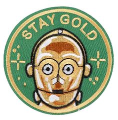 a patch with the words stay gold and an image of a man's face