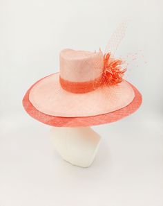 Gorgeous peach parisisal fedora with a hot coral sinamay brim extension. Accented with coral netting and feather flowers. 59cm. Hand stitched using the highest quality materials. One of a kind. Orange Short Brim Hat For Spring, Orange Wide Brim Straw Hat For Spring, Orange Straw Hat With Curved Brim For Spring, Orange Curved Brim Straw Hat For Spring, Spring Orange Straw Hat With Curved Brim, Elegant Pink Fedora For Summer, Spring Top Hat With Feather Trim, Elegant Red Fedora For Spring, Elegant Pink Summer Fedora