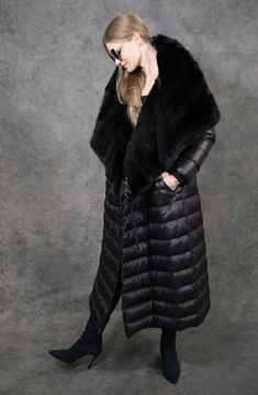 Maxi Puf-Fur A warm statement puffer with a Fashionista vibe. The dramatic, oversized, luxurious faux-fur lapel creates a cozy, double cover. The entire coat folds into itself and turns into a shoulder bag for easy carrying (no need for coat check). Style Details Maxi length Straight-line silhouette Removable bib Oversized luxurious faux fur lapel collar Magnetic front closure on bib Optional tie closure on coat 4 slant, triangle-welt, fleece-lined handwarmer side pockets 2 large, overlapping, z Winter Faux Fur Outerwear With Padded Collar, Winter Outerwear With Padded Collar And Faux Fur, Winter Sheepskin Outerwear With Faux Fur Trim, Luxury Feather Trim Outerwear For Fall, Luxury Feather Trim Fall Outerwear, Faux Fur Puffer Outerwear For Cold Weather, Elegant Fluffy Winter Outerwear, Elegant Winter Fur Coat With Feather Trim, Faux Fur Puffer Outerwear For Winter