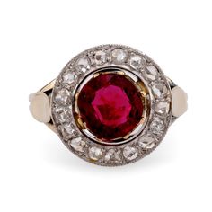 Center Stone: Round Brilliant Cut Spinel Weight: Approximately 1.4 Carat Color: Clarity: Accent Stone: 17 Rose Cut Diamonds Weight: Approximately .30 Carats Color: H Clarity: SI Metal: 18K Yellow and White Gold  Era: Belle Époque Circa: 1910's Hallmarks: French Owl Size: 6 and can be resized This exquisite French Belle Époque target ring from the 1910s features a captivating 1.4-carat round brilliant cut spinel at its center, set in a beautiful combination of 18K yellow and white gold. Encircling the spinel are 17 shimmering rose cut diamonds, totaling approximately 0.30 carats, with H color and SI clarity, adding a delicate sparkle to this intricate design. Hallmarked with the French owl, a symbol of fine craftsmanship, this ring is a stunning example of Belle Époque elegance and sophisti Target Ring, Yellow Gold Cocktail Ring, Unique Rings Vintage, Platinum Diamond Engagement Rings, Gold Cocktail Ring, Gold Cocktail, Band Jewelry, Diamond Shop, Belle Epoque