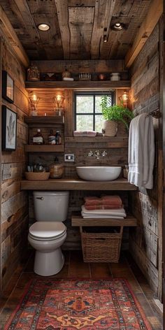 a bathroom with wooden walls and flooring in the corner, along with a rug on the floor