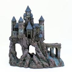 a castle made out of rocks on a white background