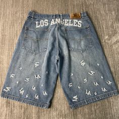 Vintage 2000s Victorious Jeans Los Angeles Dodgers MLB Baseball All Over Print Y2K Aesthetic Blue Denim Jean Shorts 38 Waist Mens Condition:  Excellent Used Condition  = No Flaws Measurements: Please see photos above for all measurements IF YOU BUY TWO OR MORE ITEMS USE THE CODE BUNDLE @ CHECK TO SAVE 20% WE SHIP WITHIN 24 HOURS AFTER PURCHASE! Please be aware that we do not offer free returns!! The Buyer is responsible for the cost of the return label. Follow us on TikTok & Instagram @findsnostalgic and tag us in your finds Blue Y2k Streetwear Bottoms, Blue Y2k Bottoms For Streetwear, Y2k Cotton Jean Shorts For Streetwear, Denim Streetwear Bottoms With Letter Print, Denim Bottoms With Letter Print For Streetwear, Y2k Style Jean Shorts For Summer Streetwear, Y2k Style Relaxed Fit Streetwear Shorts, Y2k Short Jeans For Streetwear, Y2k Jean Shorts For Streetwear