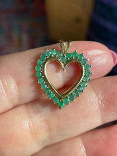 10K Gold Emerald & Diamond Heart Pendant  Perfect gift for Valentine's Day,  Birthday, Wedding, Christmas or just because  26 Prong set emeralds. Nice color and clarity, given that most emeralds set in jewelry do have inclusions  2.2 Grams on MY SCALE  BE Sure to follow on INSTAGRAM for weekly updates and sales @missionmod  CHECK OUT OUR OTHER JEWELRY, INCLUDING  CHARMS SUCH AS... VICTORIAN 18K 14K AND 10K LOADS OF GOLD TO SELL! **ALL METALS AND STONES ARE TESTED TO BE SUCH,BUY WITH CONFIDENCE THAT HERE AT MISSION*MOD WE STRIVE TO BRING YOU THE BEST WE CAN FIND...RANGING FROM VINTAGE TO ANTIQUE JEWELRY, CLOTHING AND EVERYTHING ELSE IN BETWEEN** We are more than happy to answer any question you may have about any item listed. We stand by our items here at MissionMod.  Be sure to stop by, lo Heart-shaped Emerald Necklaces For Anniversary, Heart-shaped Emerald Necklace For Anniversary, Anniversary Heart-shaped Emerald Necklace, Heart-shaped Emerald Jewelry With Birthstone, Heart-shaped Green Emerald Ring For May Birthstone, Emerald Heart Charm Jewelry, Heart-shaped Emerald Jewelry For May Birthstone, Heart Shaped Green Emerald Ring For May Birthstone, Heart Cut Emerald Jewelry In Yellow Gold