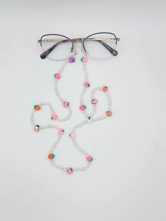 Cutie little fruity glasses chain! This glasses chain is sweet and dainty with its pearls, berries and cherries. This is perfect for completing your summer outfit, or just to keep your everyday glasses or sunglasses safe. Summer Party Glass Necklaces, White Glasses Chains As Summer Gift, White Glasses Chains For Summer Gift, Trendy White Glasses Chains With Colorful Beads, Handmade Glasses Chains For Summer Party, Handmade Summer Party Glasses Chains, Summer Everyday Glass Glasses Chains, Multicolor Glasses Chains For Summer Parties, Multicolor Summer Party Glasses Chain