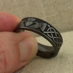 Claddagh and Celtic Wedding Ring in Black Zirconium 8 mm wide Claddagh with Celtic Knot wedding band Flat Profile with Polished Finish Size 9.5 In Stock! Ships Immediately. Celtic Knot Wedding Ring, Celtic Knot Wedding, Claddagh Ring Wedding, Wedding Ring Sizes, Viking Ring, Black Wedding Rings, Celtic Knot Ring, Celtic Wedding Rings, Celtic Wedding