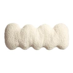 three pieces of white wool are lined up on top of each other, with one piece in the middle