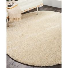 a large white rug in a living room