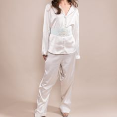 "Victoria's Secret" Silky Loungewear Set. Elastic Band Around Pant Waist And Button Front Closures On The Shirt Front. 100% Polyester Made In Sri Lanka Machine Wash Warm Measurements: Shirt Length: 28in Bust: 21in Shoulder: 5in Sleeve: 23in Pants Waist: 30in Length: 41in Size: M/L Elegant Fitted Sleepwear For Pajama Party, Elegant Satin Sleepwear With Long Pants, Elegant Satin Long Pants Sleepwear, Elegant Satin Daywear Set, Elegant Fitted Sleep Sets, Elegant White Bedtime Set, Elegant White Sleepwear For Loungewear, Chic White Satin Sleepwear, Elegant White Sleepwear