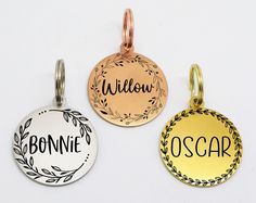 three different types of personalized pet tags on a white background, one with the word'willow'in black and one with the word'oscar'written below it