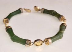 "This lovely and unusual vintage 1950s-60s spinach jade bracelet is approximately 8\" long with a secure and easy to use clasp. The spinach green jade is very beautifully carved with links made to look like bamboo as they curve around the wrist. I've never seen one quite like it. While unmarked, the metal is gold toned and is probably either gold over silver or gold filled material. I cannot see any brass or other base metal coming through. It's a very sweet piece. It's elegant and stunning and Chinese Spinach, Jade Accessories, Chinese Jewelry, Carved Jade, Jade Bracelet, Jewelry Lookbook, Jade Carving, Bracelet Vintage, Old Jewelry