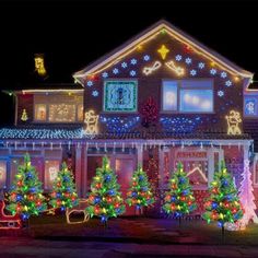 a large house covered in christmas lights and decorations