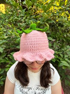 Embrace the whimsy of nature with this delightful handmade crochet bucket hat! Designed to mimic the look of a ripe strawberry, this light pink hat is topped with a charming cluster of green leaves, making it the perfect accessory for anyone who loves a touch of playful fashion. The soft scalloped edges add an extra layer of cuteness, making this hat as comfortable as it is stylish. - **Materials Soft and durable yarn, ensuring a cozy fit and long-lasting wear. - **Size Available in all sizes: N Crochet Strawberry Top, Strawberry Shortcake Halloween, Light Pink Hat, Playful Fashion, Halloween Hat, Crochet Strawberry, Strawberry Topping, Crochet Bucket, Crochet Bucket Hat