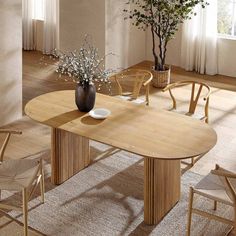 a wooden table with chairs around it and a vase filled with flowers on the table