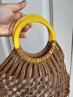 Vintage 70s macrame handbag shopping bag handmade avoska bag boho bohemian This is a beautiful handmade macrame bag. Original from the 60s or 70s this bag is made to last. Made of plastic rope. It will last a life time Has some age marks on the plastic (handles and rope) please see photos with details. Perfect for the beach or to market Shipping is registered I can combine shipping 70s Macrame, Macrame Handbag, Market Bags, Macrame Bag, Chunky Bracelets, Handmade Macrame, Thumb Rings, Bag Handmade, The 60s