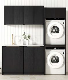 two black cabinets with white appliances in the middle and one has a green plant on top