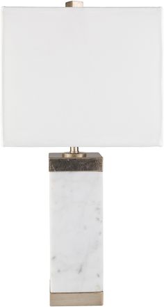 a marble lamp with a white shade on it