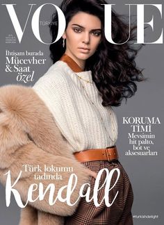 a magazine cover with a woman wearing a white sweater and fur coat on the cover