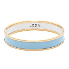 This handmade enamel bangle in soothing forget-me-not blue makes a sleek staple accessory.   It slides easily over the wrist and has been crafted in England by the Halcyon Days artisans. It's finished with 18ct gold plated raised edges. Forget Me Not Blue, Pouch Making, Willow Weaving, Halcyon Days, Enamel Bangle, Crystal Glassware, Candle Inspiration, Donate To Charity, Gold Bangle