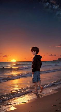 a boy is standing on the beach at sunset