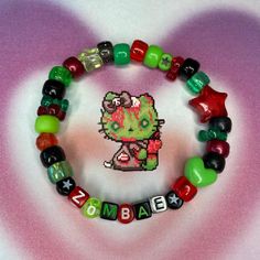 Scenecore Zombie "zombae" Kandi Bracelet - Handmade... - Depop Yellow Kandi Bracelets, Scene Bead Bracelets, Pokemon Kandi Bracelet, Weirdcore Bracelets, Themed Bracelet Ideas, Character Kandi Bracelets, Kandi Bead Bracelets, Kandi Perler Beads, Candi Bracelet Idea