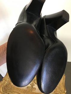 "Vintage 1920s shoes Black leather Round toe Unique cut out design on the vamp Scalloped details on the side Elastic inserts Chunky heel Gorgeous antique condition Deadstock / never worn Original box Stamped a size 5 length 9 1/4\" Width 2 7/8\" Heel 2 3/4\"" Vintage Black Leather Shoes With Rubber Heel Cap, Vintage Black Leather Court Shoes, Vintage Formal Boots With Stacked Heel, Retro Black Leather Court Shoes, Black Retro Leather Court Shoes, Rockabilly Jeans, 20s Shoes, Flapper Shoes, Art Deco Shoes