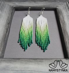 These green fringe earrings are made of high-quality Czech beads and strong synthetic thread. They are elegant, fashionable, and highly versatile, suitable for everyday wear. Features: Sterling silver components Color: green, white. This item is currently in stock. You must be completely Handmade Green Chandelier Earrings For Summer, Green Dangle Chandelier Earrings For Summer, Elegant Green Beaded Earrings With Tassels, Summer Green Dangle Chandelier Earrings, Green Beaded Earrings With Fringe For Summer, Green Fringe Earrings For Summer, Elegant Green Tassel Earrings With Round Beads, Green Beaded Earrings With Beaded Fringe, Green Fringe Round Bead Earrings