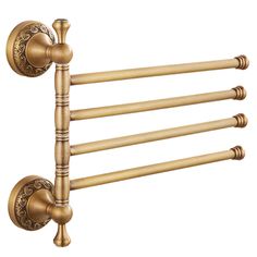 an antique brass towel rack with four bars