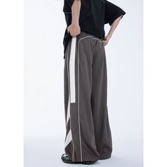 Water-Repellent Sports Patchwork Wide Leg Pants A Fabric: 90% Nylon+10% Spandex B Fabric: 55% Polyester+45% Nylon Size: S, M, L, XL Pants Type: Wide Leg Pants Multiple Color Selections: Black, Dark Gray  Season: Spring, Fall, Summer Nylon Wide Leg Parachute Pants For Sports, Stretch Pants With Contrast Color For Streetwear, Sportswear Bottoms With Contrast Color And Stretch, Streetwear Bottoms With Contrast Color And Long Pants, Wide Leg Nylon Parachute Pants For Sports, Gray Nylon Athleisure Bottoms, Casual Stretch Pants With Contrast Color, Sporty Gray Streetwear Pants, Casual Sports Bottoms With Contrast Color