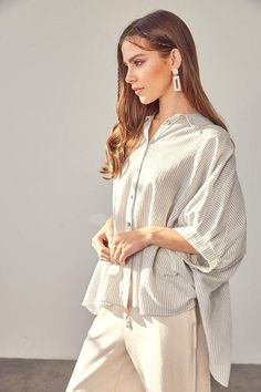 This button-up collared shirt is perfect for casual weekend wear. Loose-fit and crafted from rayon, it's comfy and chic for any occasion. With a classic striped pattern, a hi-low silhouette and cool half-sleeves, this is surely one of your closet's must-haves. (Wear it with a half-tuck to show off your best assets!)- Print/ Pattern: Stripe- Neckline: Collar- Silhouette: Hi- low shirt- Embellishment: Button- Length: Tops 26" & Longer- Sleeve: Half- Fit: Loose- Closure: Button- Lining: NA- Care In Tailored Design, Spring Trends, Mustard Seed, Weekend Wear, Collared Shirt, Sheer Fabrics, Print Pattern, Perfect Shirt, Casual Wardrobe