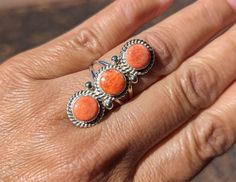 Discover the timeless beauty of our Navajo Sterling Silver Orange Spiny Oyster Ring Elevate your jewelry collection with this exquisite Navajo orange spiny oyster ring, meticulously handcrafted by skilled artisan Jadenna Frank. Crafted with love and dedication, this sterling silver ring showcases the vibrant allure of turquoise, a stone deeply embedded in Native American culture and history. Ring Size: 7.25 US Stones setting:  1.5 inches long and 1/2  inches wide Weight:  6 grams **Key Features ✦ **Authentic Navajo Design This ring is a true masterpiece of Navajo artistry. Its intricate design and detailed craftsmanship pay homage to the rich traditions of the Navajo people, known for their exceptional silversmithing skills. ✦ **Genuine  Spiny Oyster The captivating 3 stones centerpiece is Navajo Culture, Boho Trends, Native American Rings, Native American Heritage, Navajo Turquoise, Authentic Jewelry, Native American Culture, Spiny Oyster, Kingman Turquoise