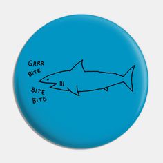 a blue button with an image of a shark and the words garr bite bite