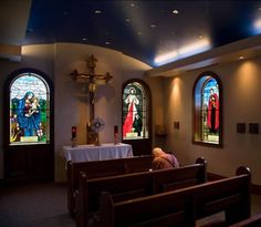 the interior of a church with stained glass windows