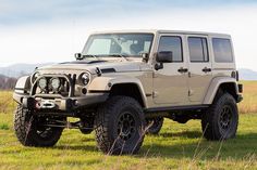 a jeep is parked in the middle of a field