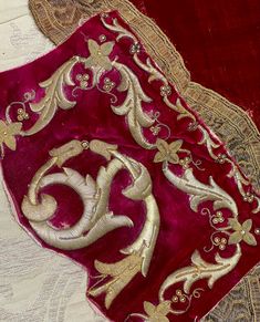 Antique Gold Embroidered Silk Velvet Fragment Dating 19th century The Magenta silk velvet hand embroidered with raised padded three dimensional metallic gold Lovely gently time appeal. General signs of wear commensurate with age and use Please study photographs as they do form a very important part of the description SIZE  11 inches x 7 inches  (28cm x 18cm) S5254 Elegant Gold Velvet Traditional Wear, Festive Gold Velvet Traditional Wear, Ceremonial Velvet Traditional Wear With Resham Embroidery, Velvet Traditional Wear With Resham Embroidery For Ceremonial Occasions, Traditional Gold Velvet Wear, Traditional Velvet Embroidered Fabric With Zari Work, Elegant Ceremonial Velvet Traditional Wear, Traditional Velvet Fabric With Zari Embroidery, Gold Velvet Traditional Wear