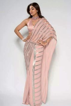 Peach sheer saree with metallic embellishment. Comes with matching blouse.
Components:2
Embellished
Neckline:V Neck
Sleeve Length:Sleeveless
Fabric:100% Polyester
Color:Peach
Sequin embellishment
Pre-stitched blouse - Aza Fashions Sheer Saree, Embellished Saree, Rahul Khanna, Ruffle Beading, Modern Saree, Desi Wear, Sequin Embellishment, Embellished Neckline, Blouse For Women