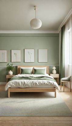 a bedroom with green walls and white furniture