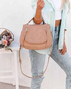 THIS ITEM IS FINAL SALE Best Seller Measurements: 12.00 "L x 5.00 "W x 9.50 "H Handle Drop: 3" Additional Shoulder Strap Drop: 20"- 23" Bag Type: Saddle Material: Faux Leather Interior Details: Two Slip Pockets. One Zip Pocket Exterior Details: Thick Stitching Details And Zipper Tassel Hardware: Gold Extras: Detachable Adjustable Strap Closure: Zipper Fabric Lining //Best Seller// The coveted Highland Bag in natural is essential for everyday wear in its designer look and practical details.Styled Thick Stitching, Tortoise Hair, Leopard Hair, Ankle Stretches, Simple Bangle, Perfect Heels, Exterior Details, Faux Leather Bag, Stitching Details