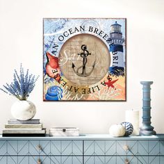 an ocean bre bar sign hanging on the wall above a blue dresser and vase