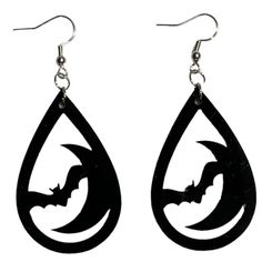 the earrings are made out of black wood and have bats on them, as if they were